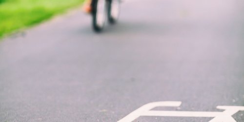 city-bike-sign-on-road-colorful-P6GFJYS-scaled.jpg