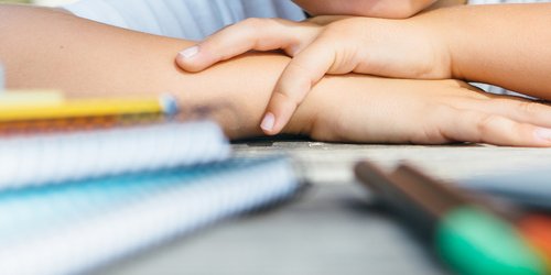 crop-child-at-table-with-school-supplies-PXVQYHG-1.jpg